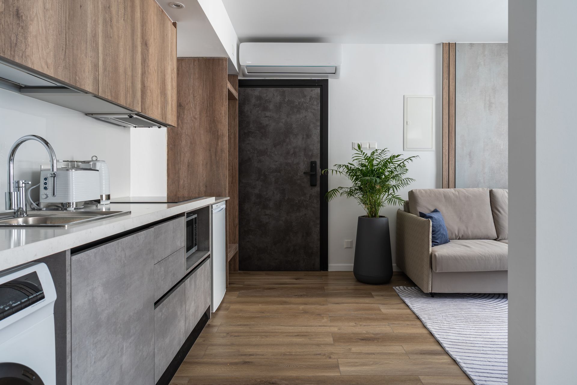 Modern kitchen and living area in a 26 Suites apartment